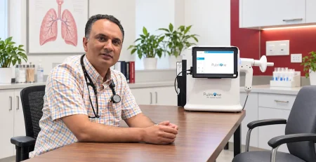 Dr G Sarwar Chaudhry with PulmOne pulmonary function testing equipment at Australian Polyclinic Lahore