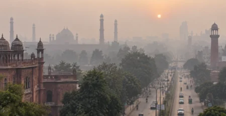 Illustrative view of Lahore streets and historic architecture under winter smog